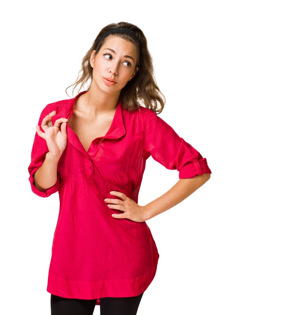 A woman in a red shirt is posing for the camera.