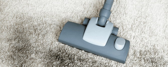 A close up of the handle on a vacuum cleaner