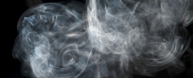 A smoke background with white swirls and black