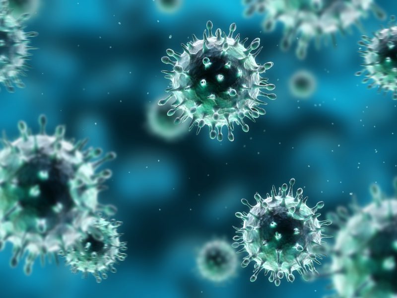 A close up of viruses on a blue background